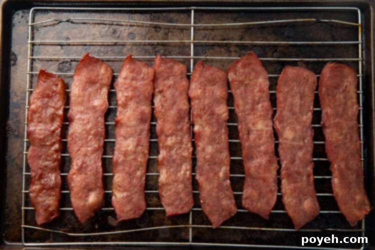 Cooked turkey bacon on a baking rack