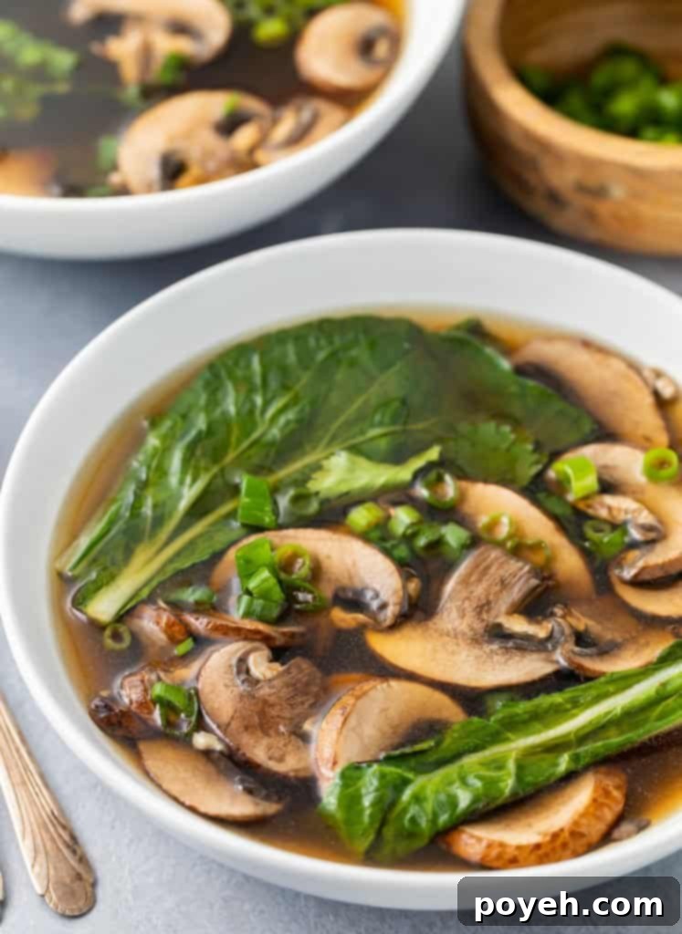Close up photo of a bowl of Chinese vegetable soup, showcasing fresh vegetables and clear broth.