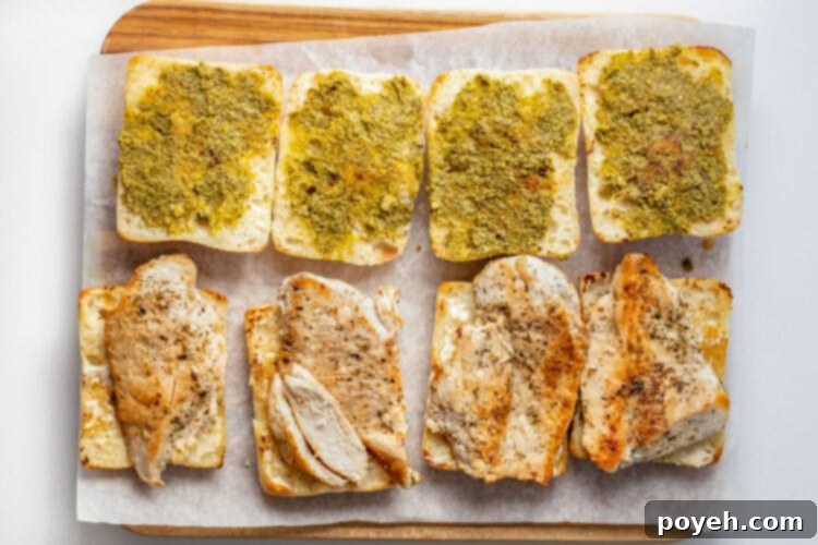 Chicken cutlets added to toasted ciabatta rolls with mayo.