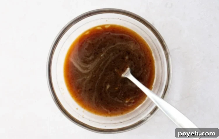 Pad Thai sauce in a small glass mixing bowl, freshly prepared.