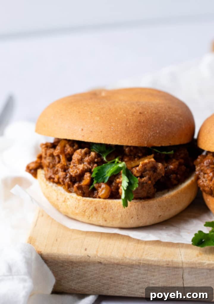 Close up of a keto sloppy joe on a keto hamburger bun, showcasing the rich, savory filling and a perfectly toasted keto bun.