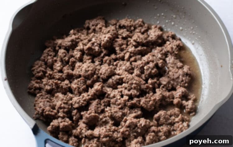Crumbled ground beef in a large skillet