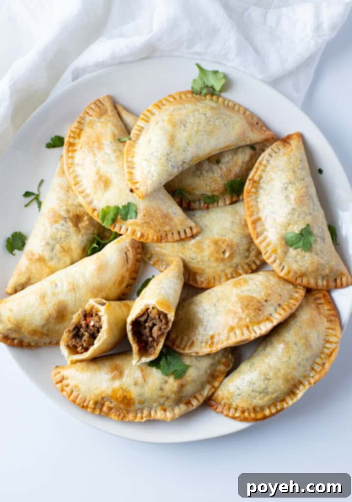 Air fryer empanadas on a wire rack cooling after cooking