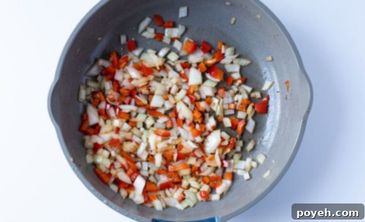Onion, bell pepper, and garlic in skillet
