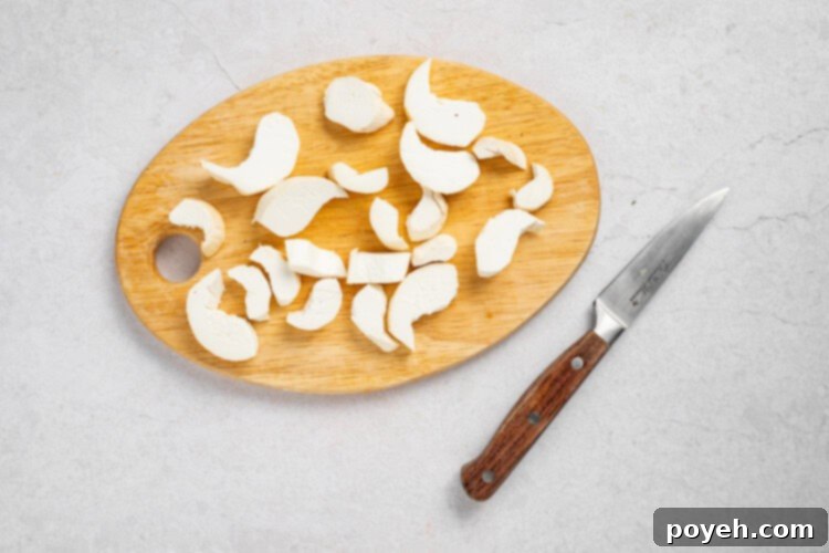 Vegan-Shrimp-LR-Process-Photo-1 - Slicing king oyster mushrooms into shrimp shapes