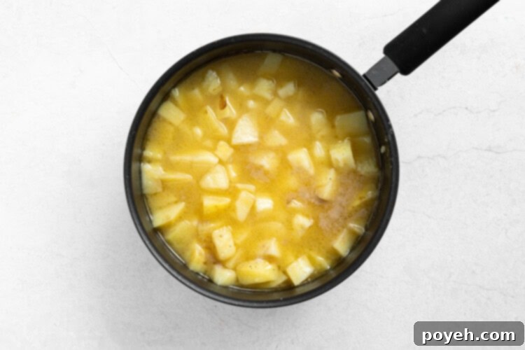 Step 2: Potatoes gently boiling in the pot, uncovered.